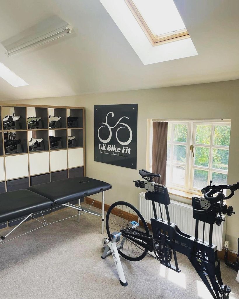 UK Bike Fit studio with Retül fit bike, assessment table and branding
